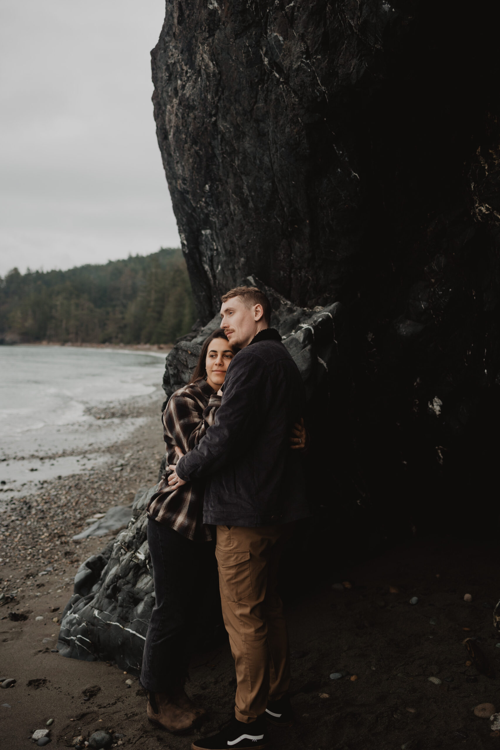a couple posing together for their engagement session at Deception Pass State Park