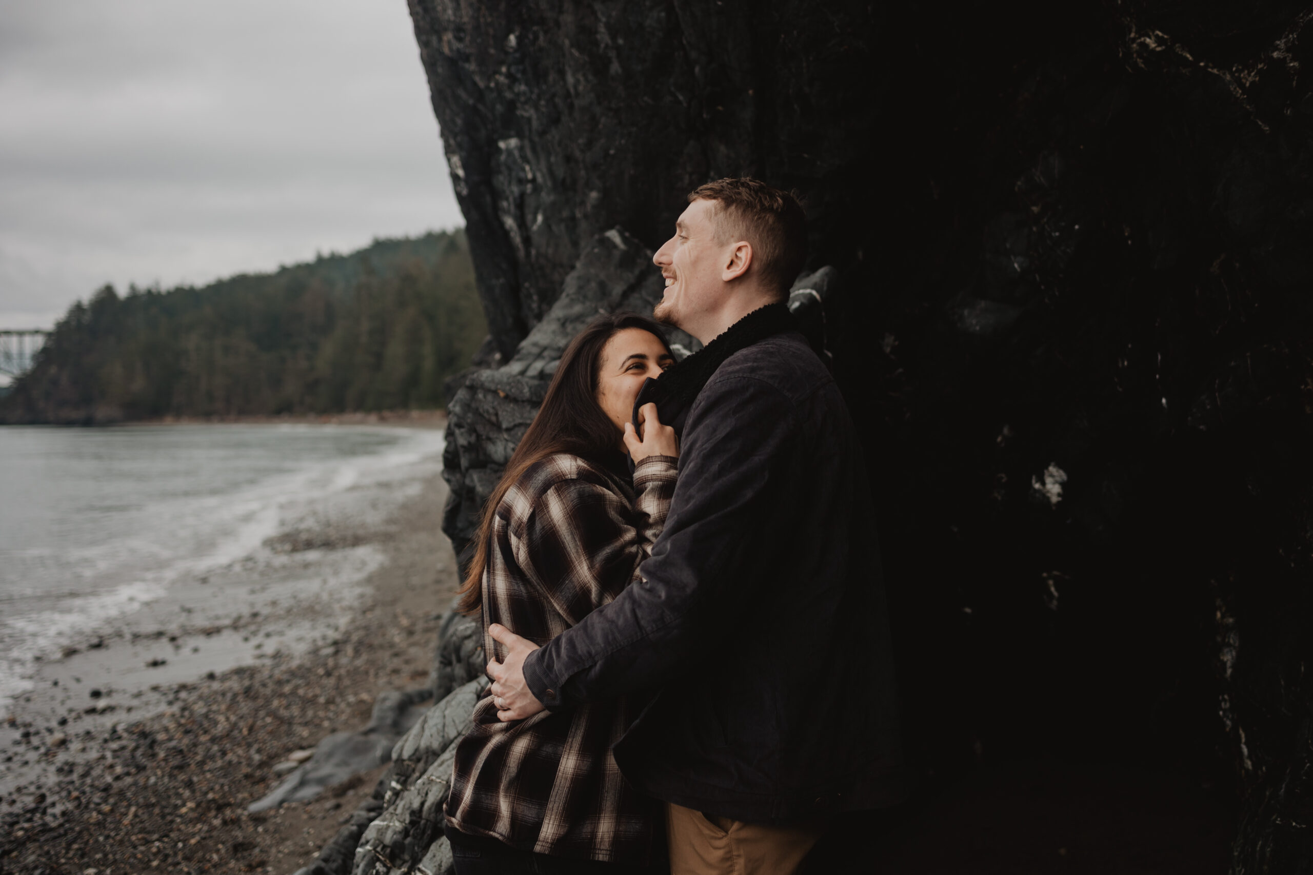 a couple posing together for their engagement session at Deception Pass State Park