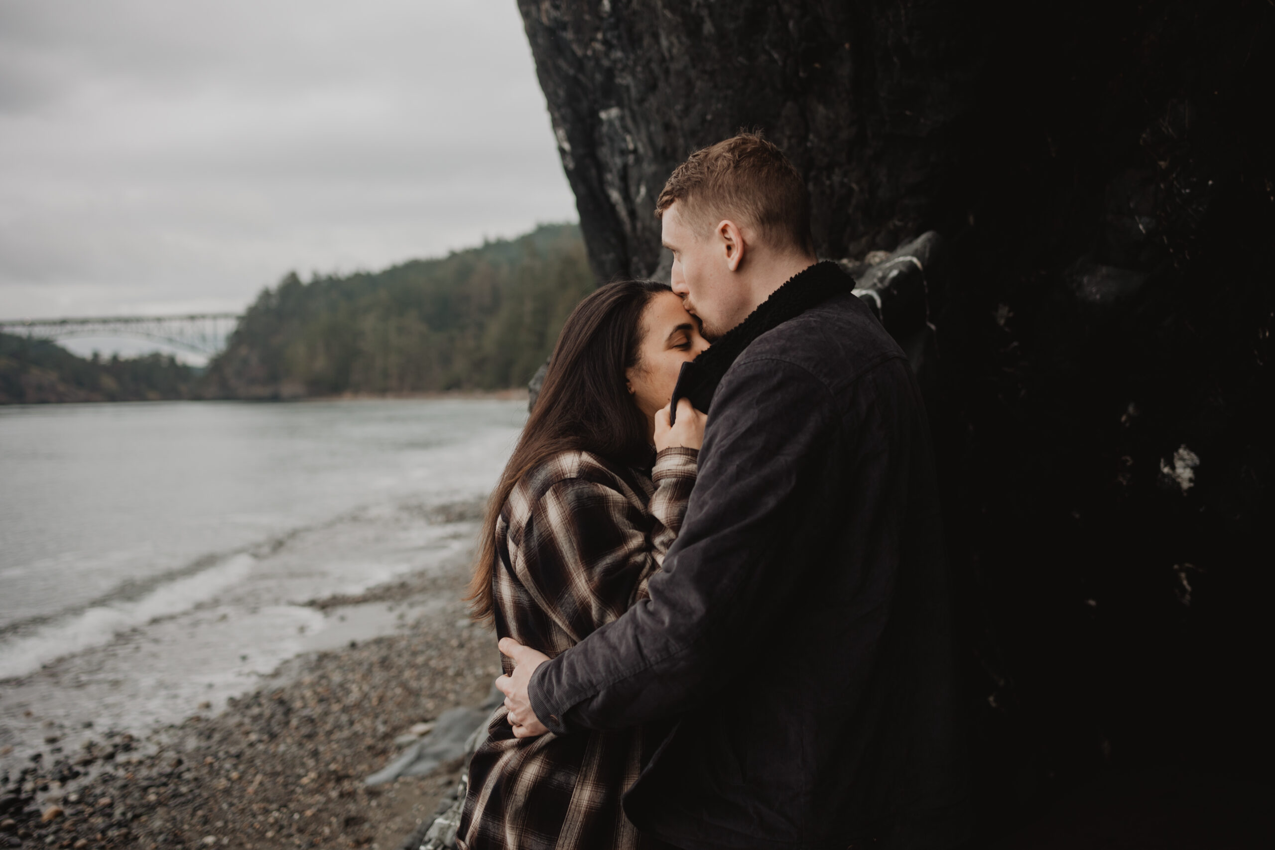 a couple posing together for their engagement session at Deception Pass State Park