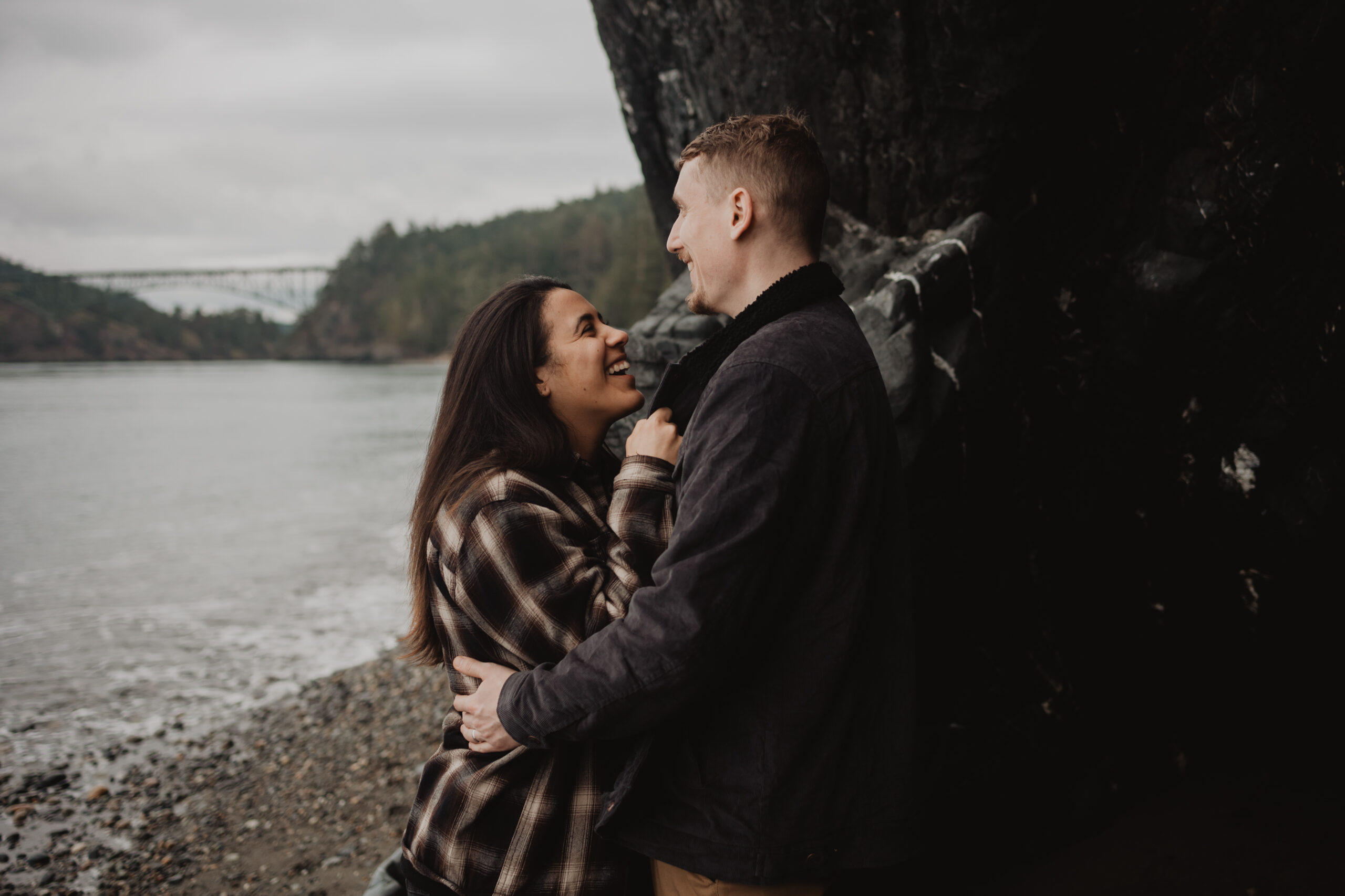a couple posing together for their engagement session at Deception Pass State Park