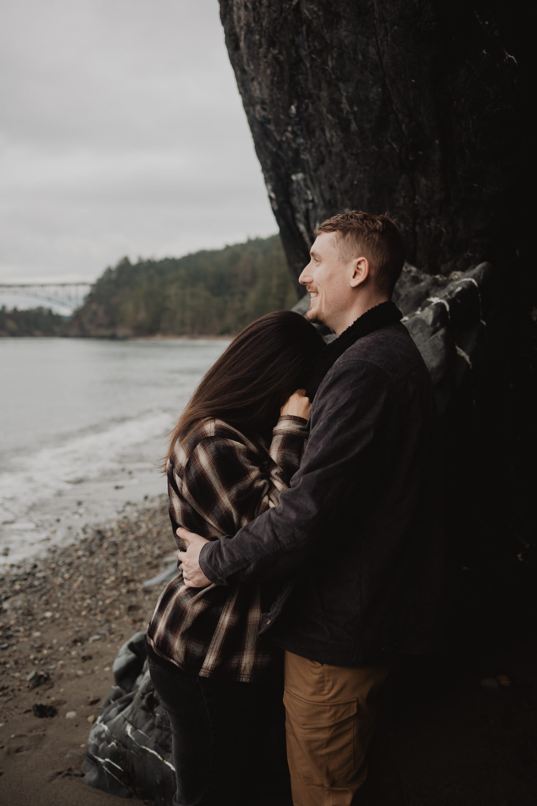 a couple posing together for their engagement session at Deception Pass State Park