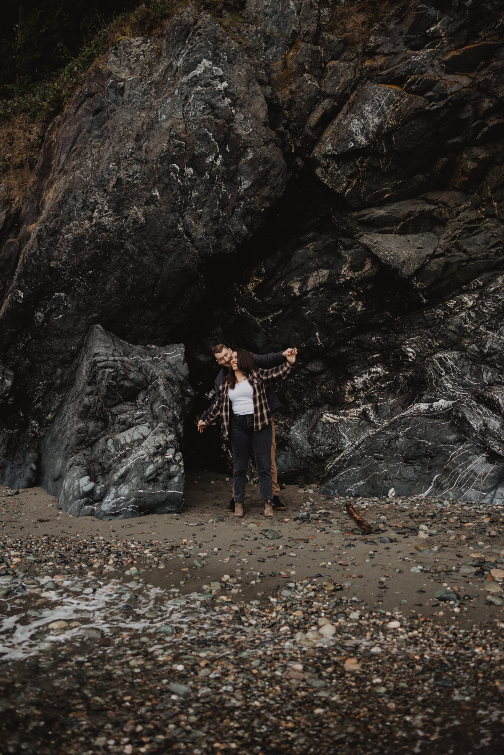 a couple posing together for their engagement session at Deception Pass State Park