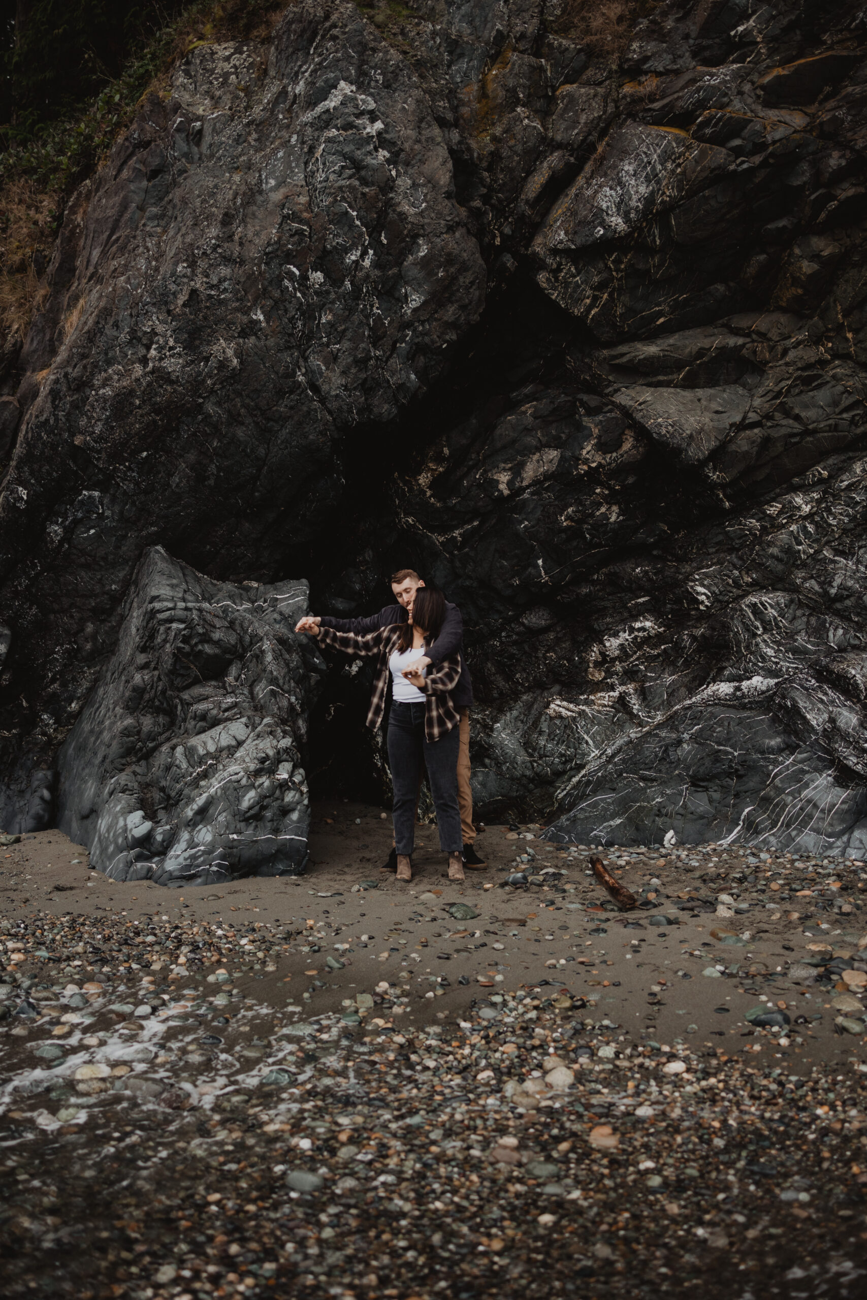 a couple posing together for their engagement session at Deception Pass State Park