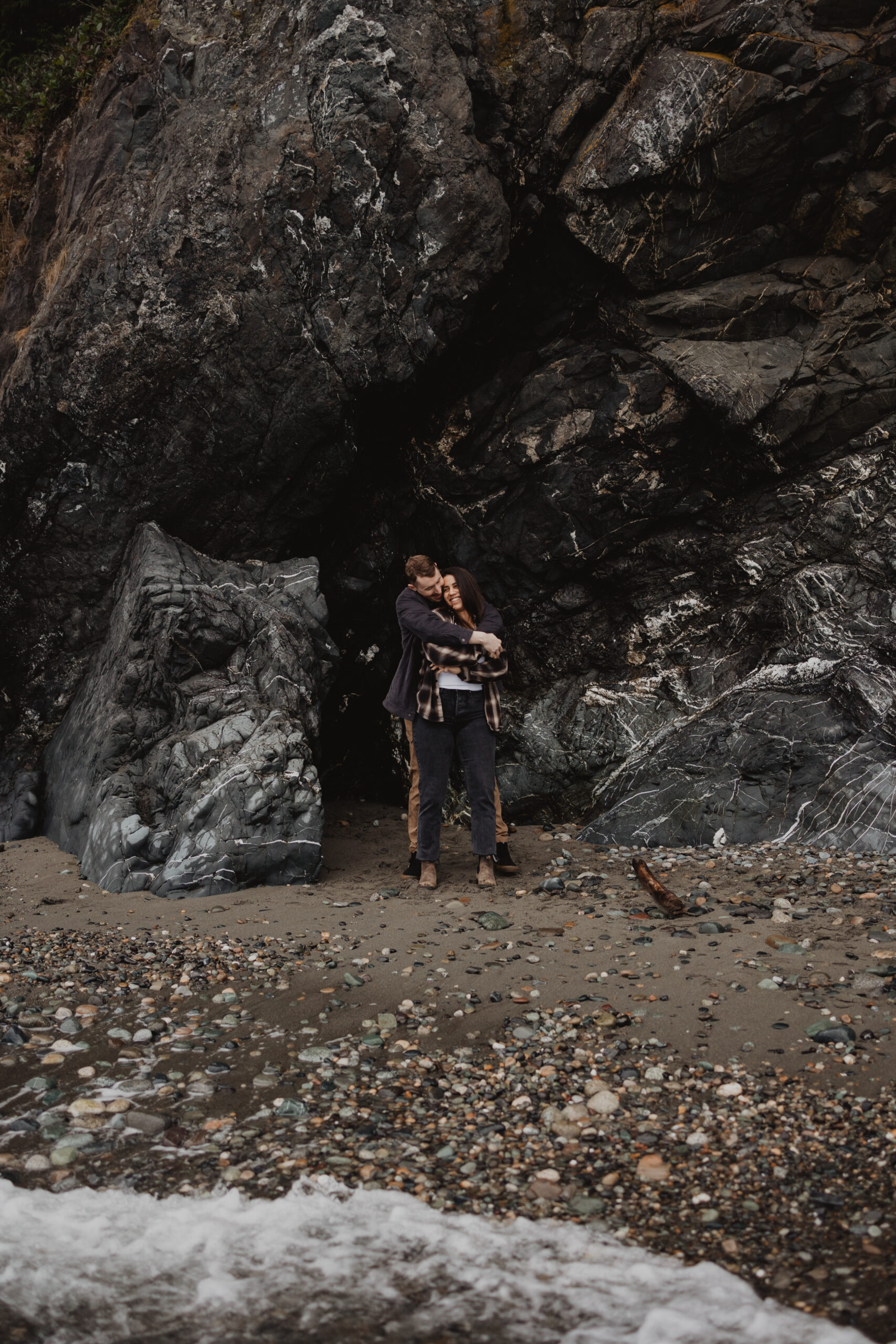 a couple posing together for their engagement session at Deception Pass State Park