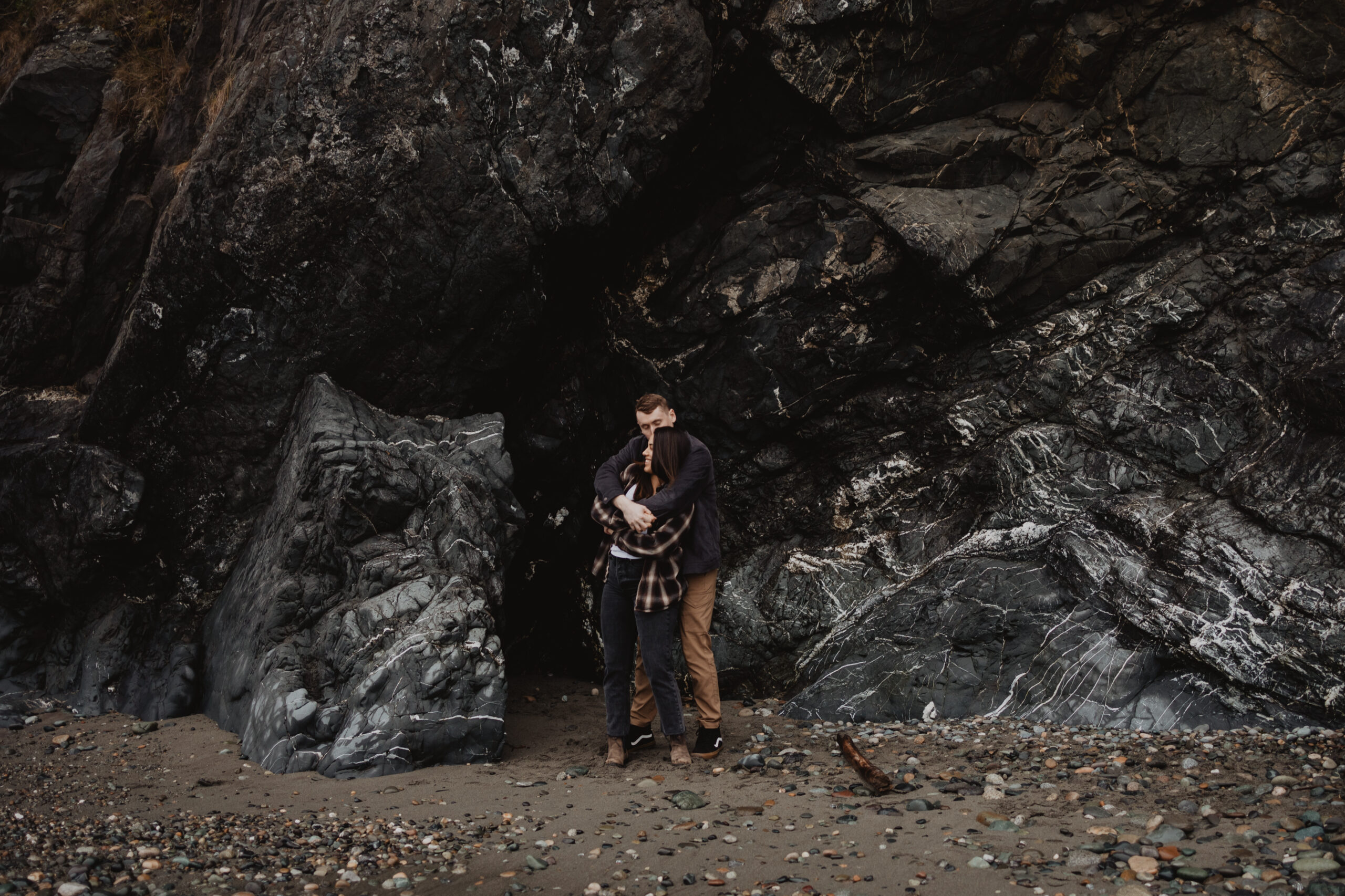 a couple posing together for their engagement session at Deception Pass State Park