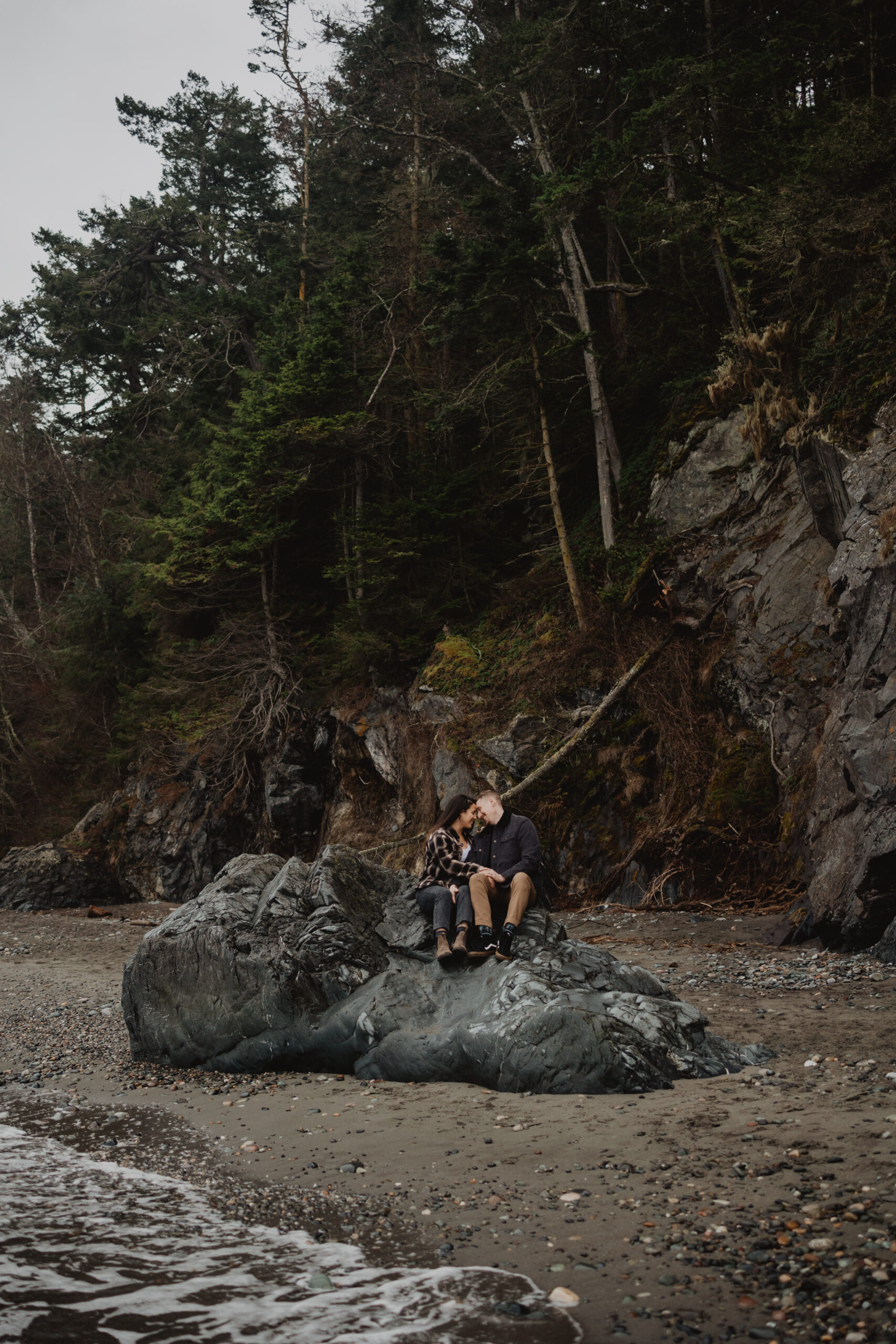 a couple posing together for their engagement session at Deception Pass State Park