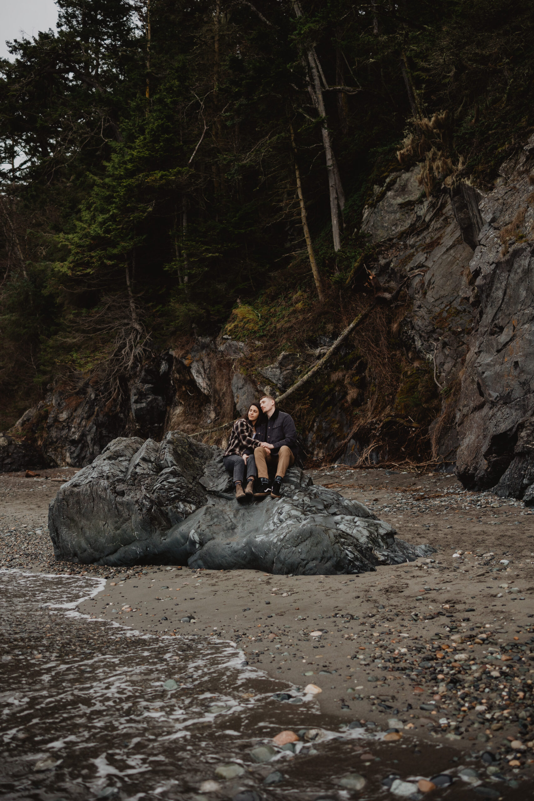 a couple posing together for their engagement session at Deception Pass State Park