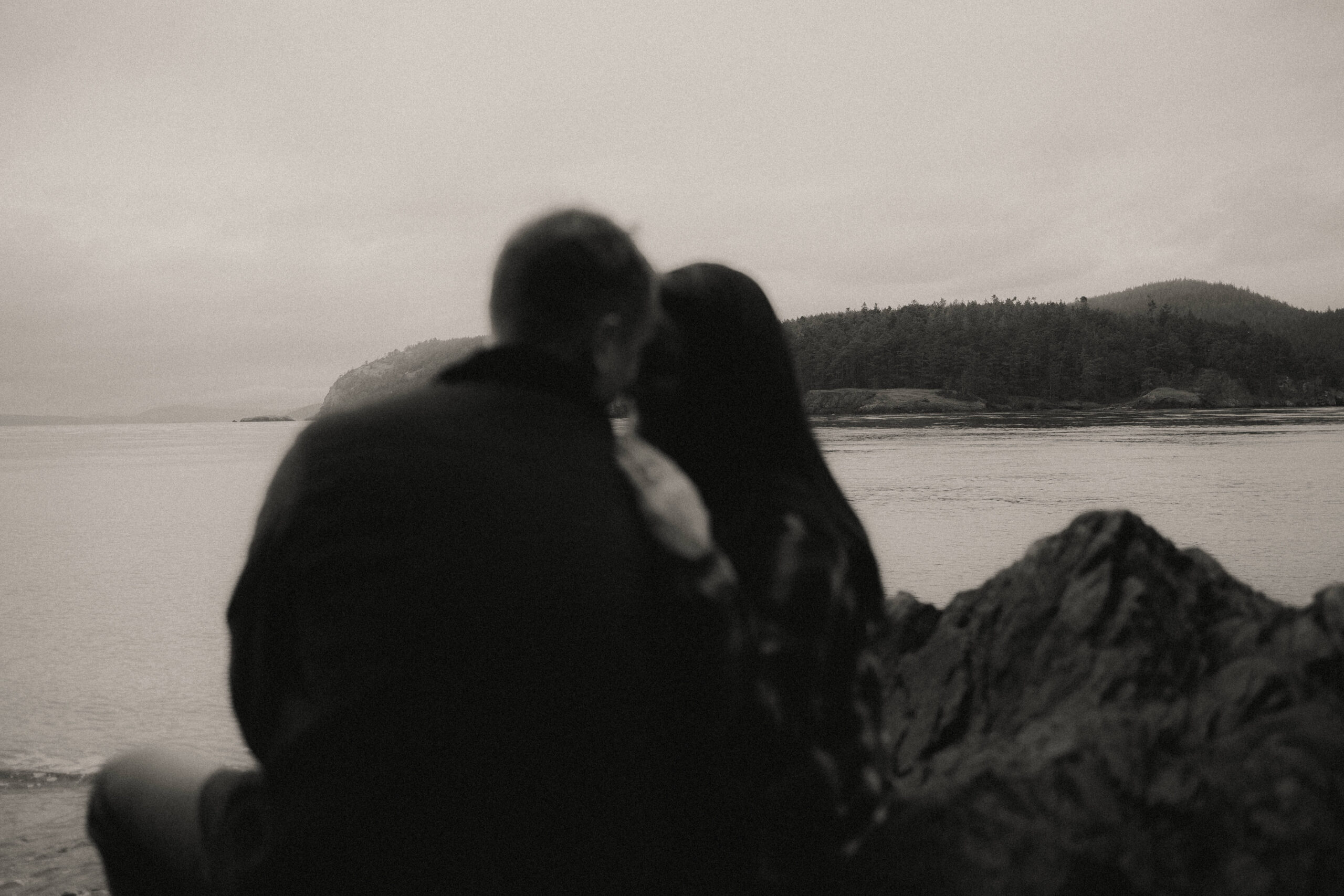 a couple posing together for their engagement session at Deception Pass State Park