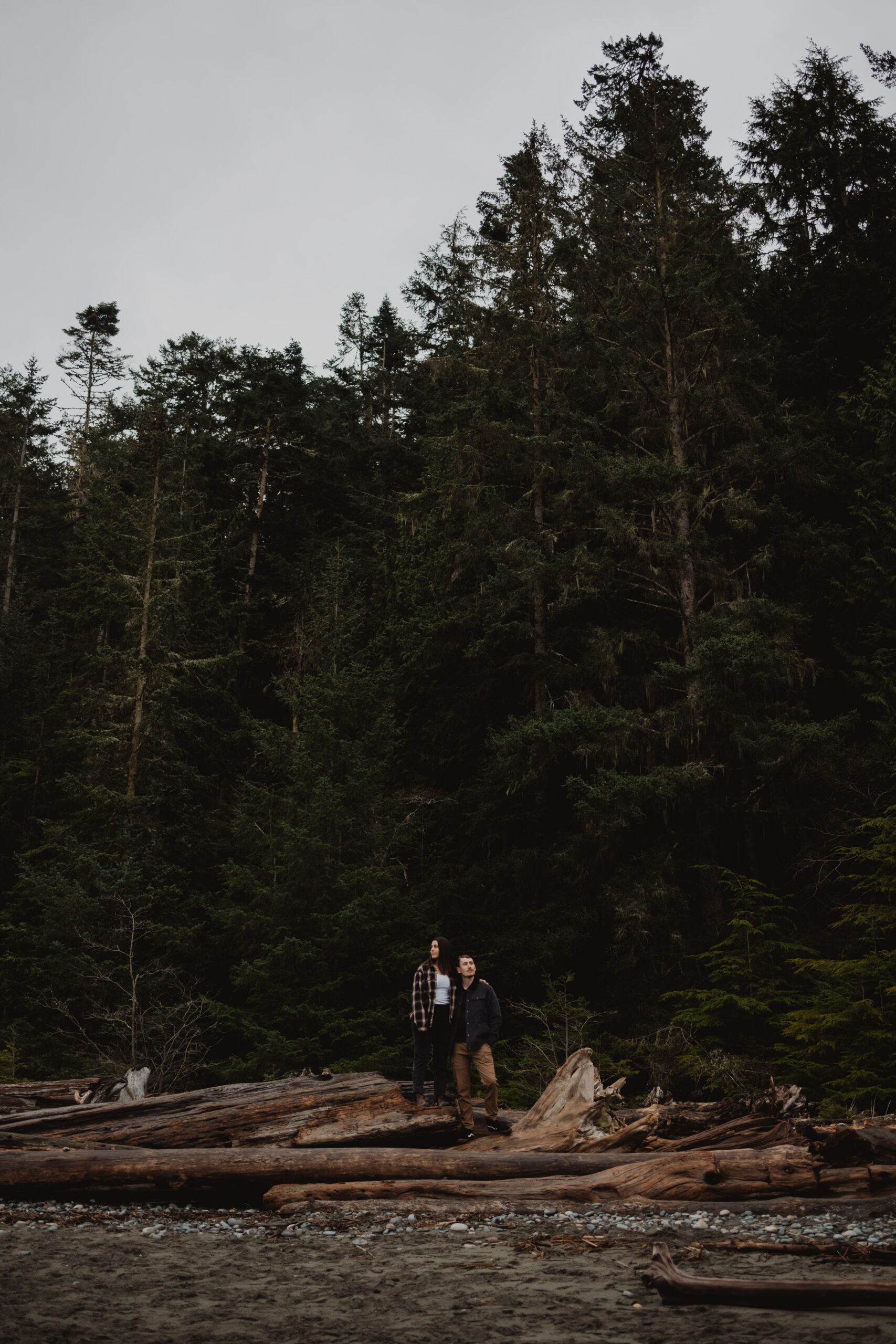 a couple posing together for their engagement session at Deception Pass State Park