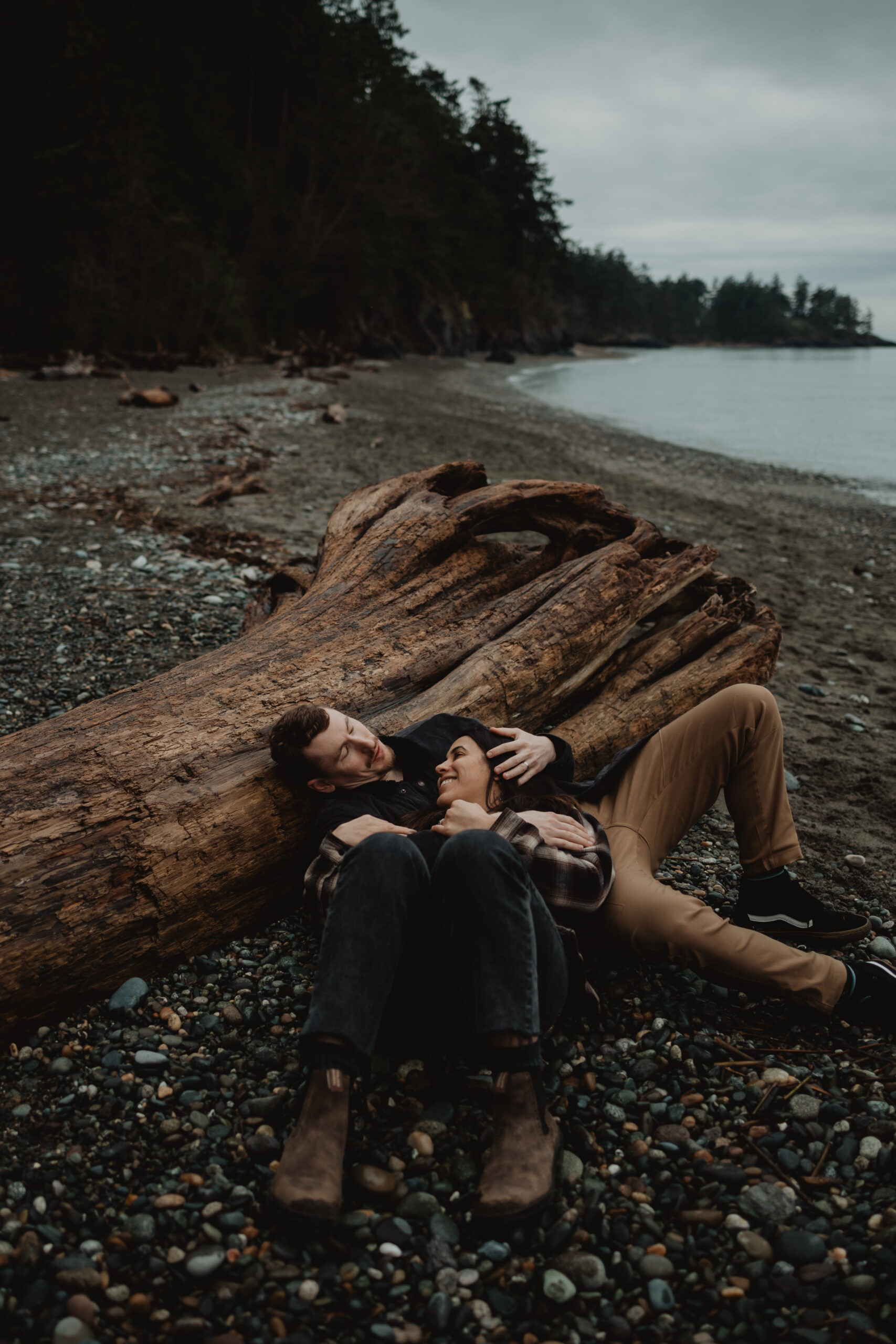 a couple posing together for their engagement session at Deception Pass State Park