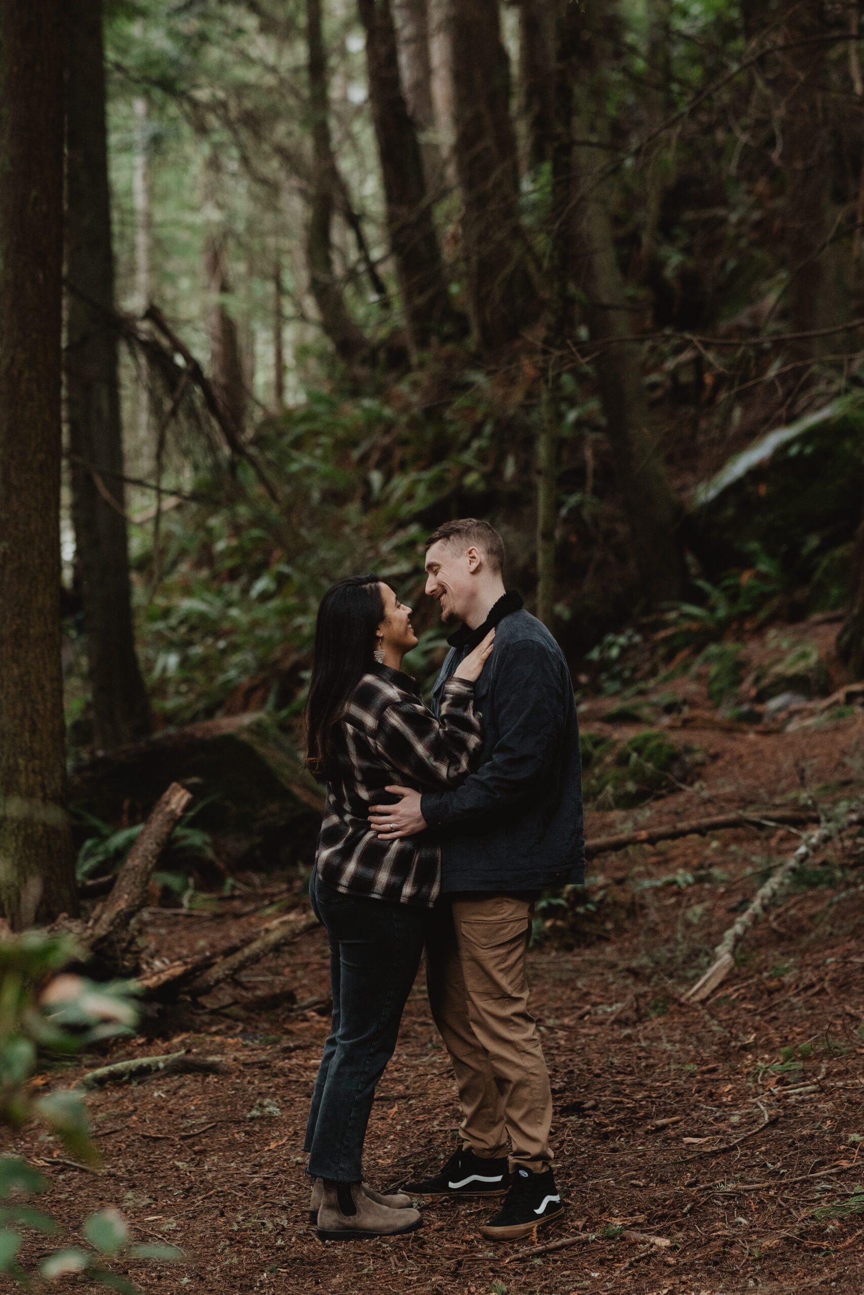 a couple posing together for their engagement session at Deception Pass State Park