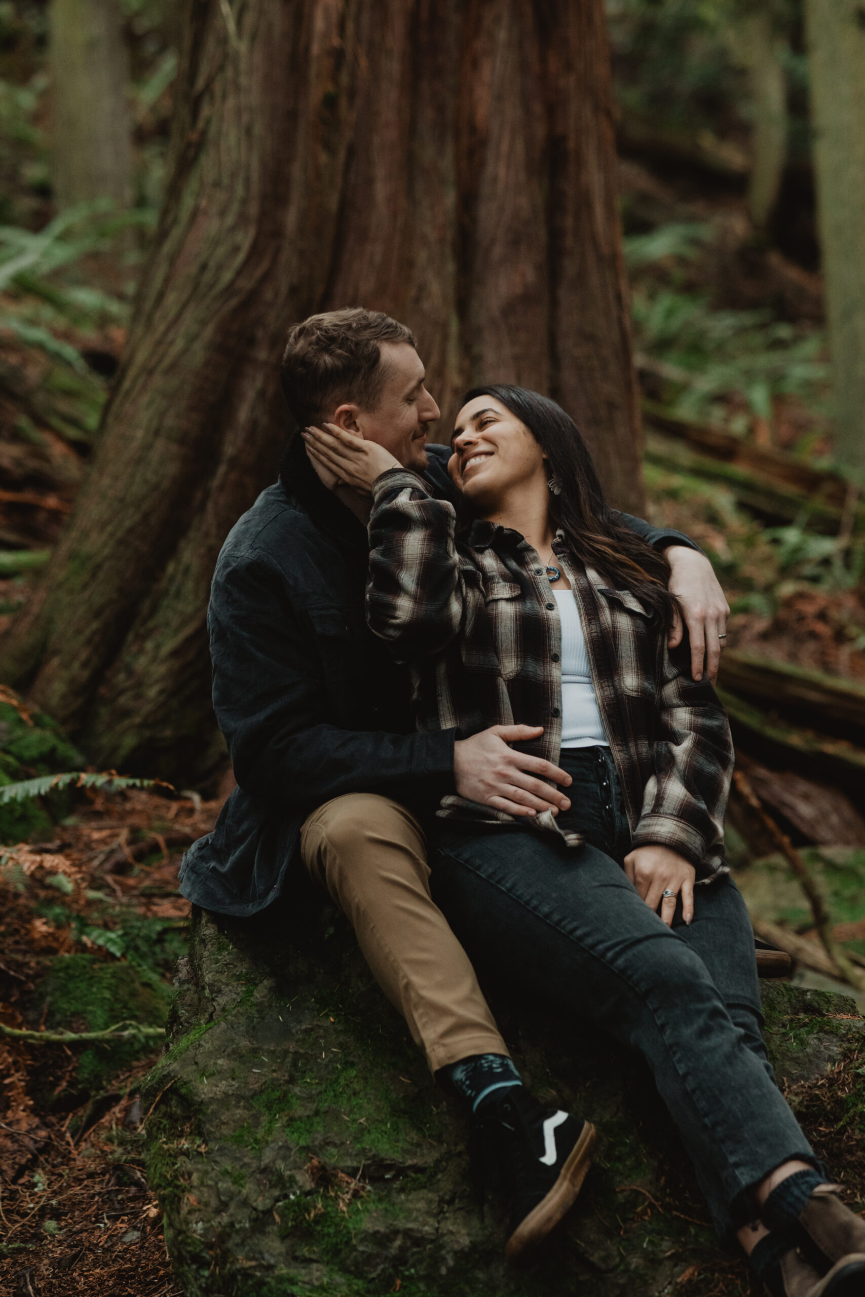 a couple posing together for their engagement session at Deception Pass State Park