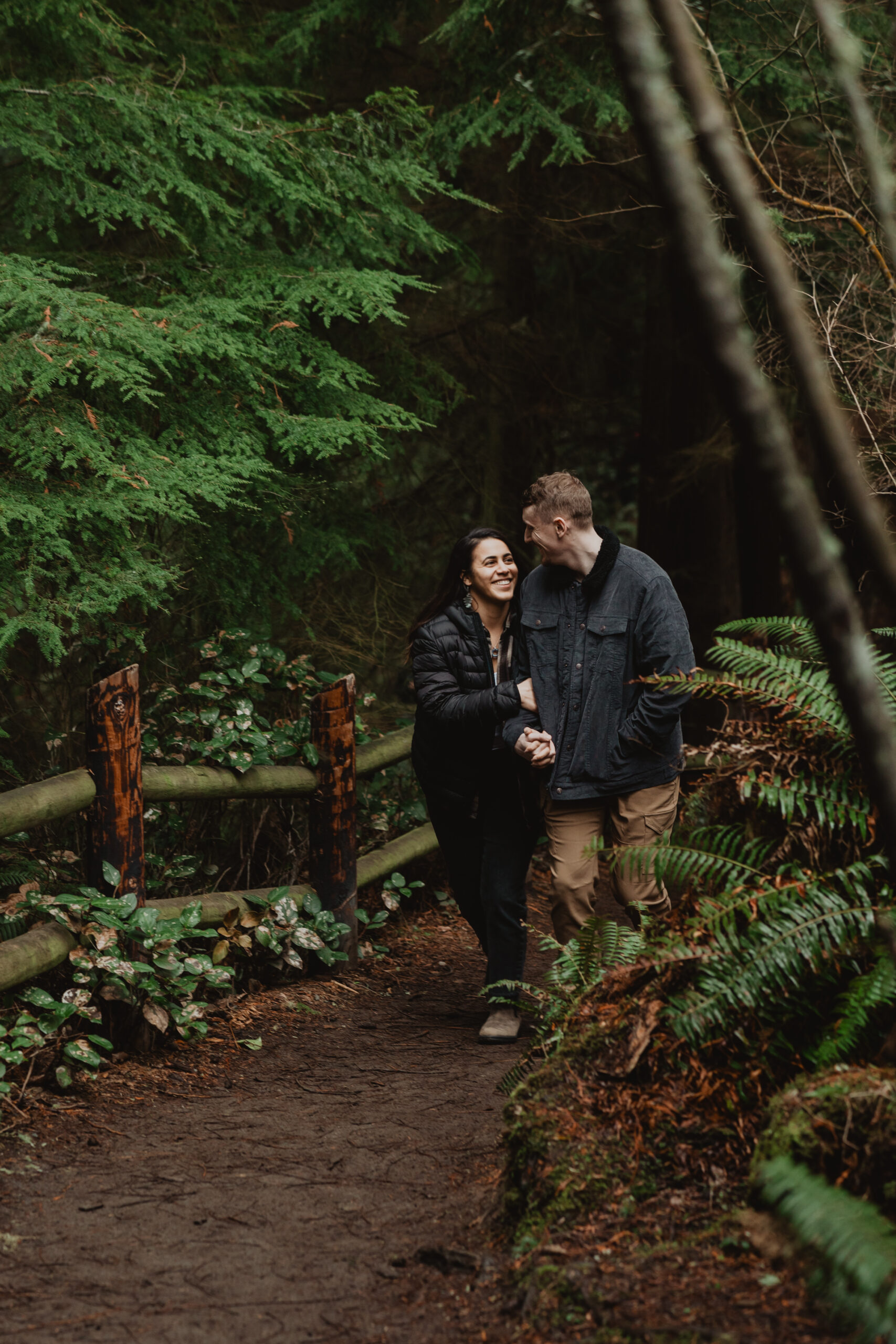 a couple posing together for their engagement session at Deception Pass State Park