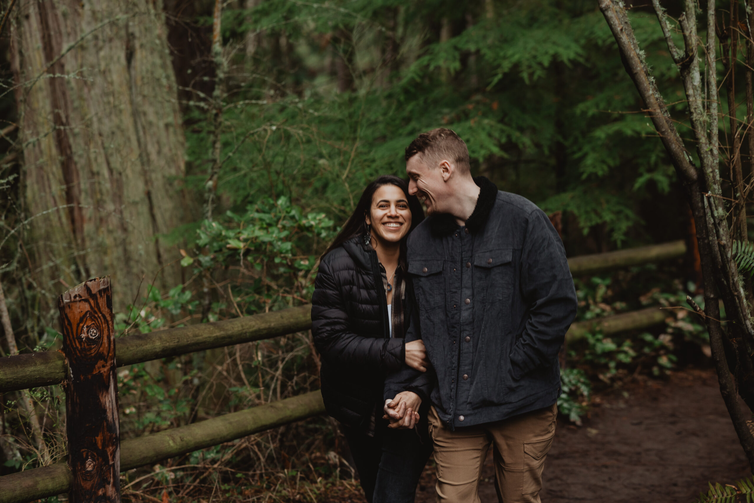 a couple posing together for their engagement session at Deception Pass State Park